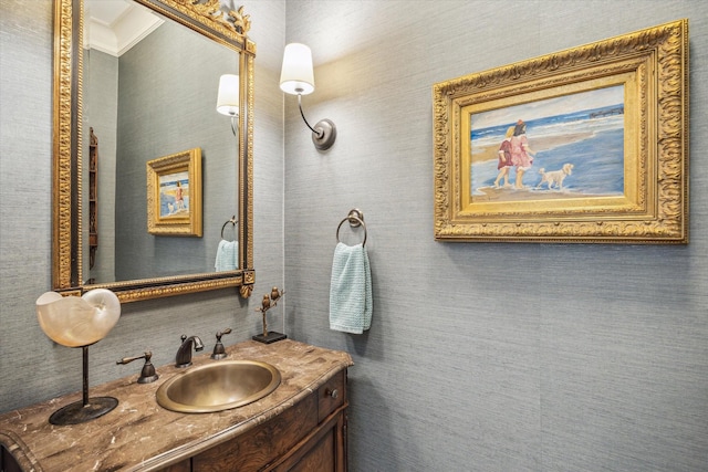 bathroom with vanity and ornamental molding