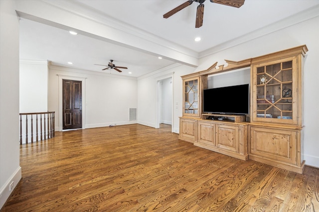 unfurnished living room featuring ceiling fan, visible vents, and wood finished floors