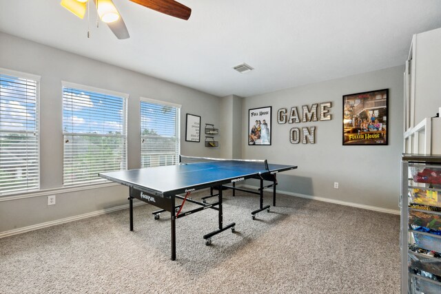 rec room with baseboards, a ceiling fan, carpet, and visible vents