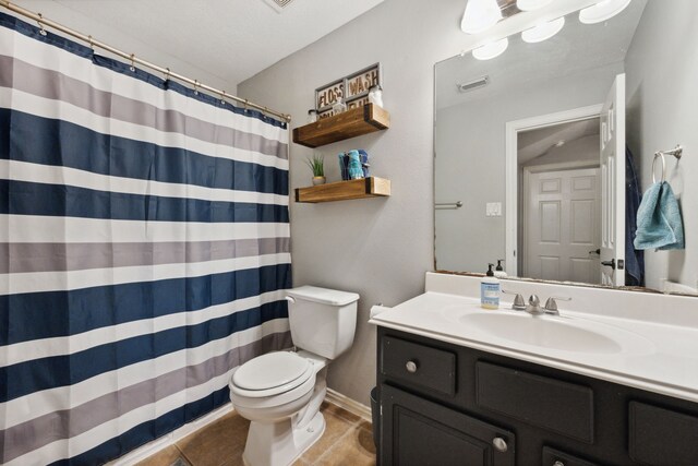 bathroom with vanity, a shower with curtain, toilet, and visible vents