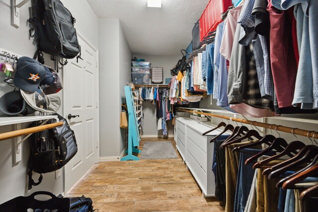 spacious closet featuring light wood-type flooring