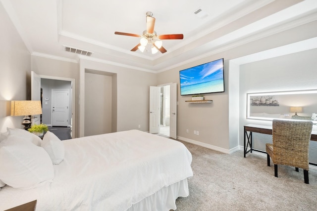 bedroom featuring visible vents, a raised ceiling, baseboards, carpet floors, and ornamental molding