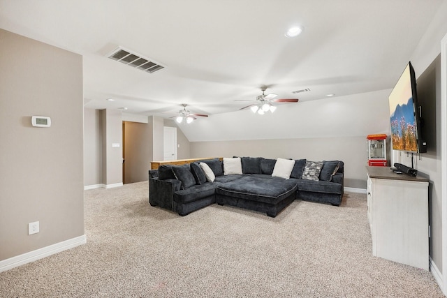 living room with visible vents, ceiling fan, lofted ceiling, and light carpet
