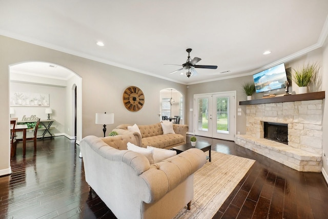 living room featuring ceiling fan, french doors, dark wood-style flooring, arched walkways, and recessed lighting
