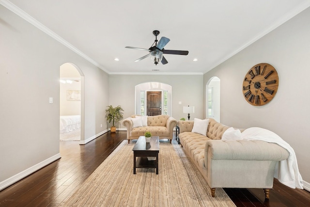 living area featuring wood-type flooring, arched walkways, ceiling fan, and recessed lighting