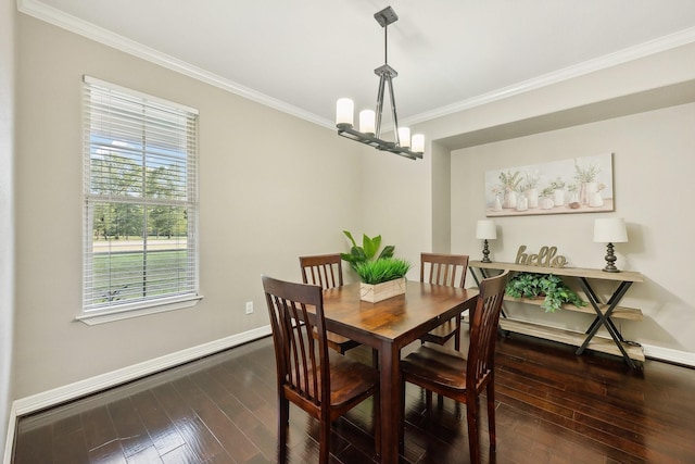 dining room with baseboards, ornamental molding, dark wood-style flooring, and a notable chandelier