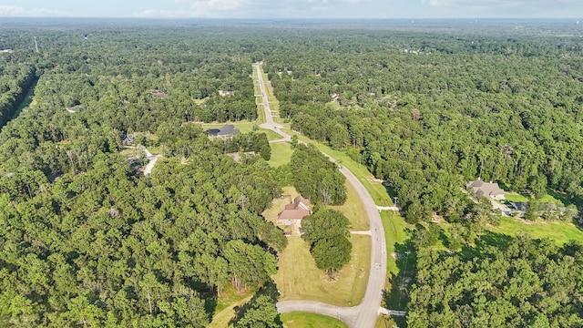 bird's eye view featuring a forest view