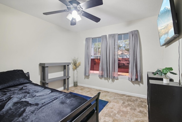 21894 Pinewilde Ct, Porter, TX 77365 - bedroom featuring baseboards and a ceiling fan