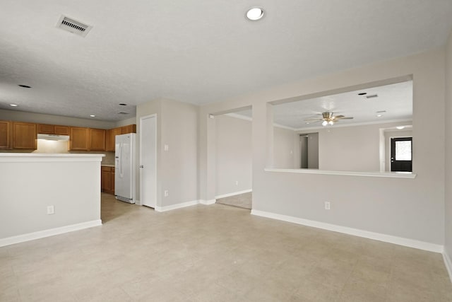 unfurnished living room with ceiling fan, recessed lighting, baseboards, visible vents, and ornamental molding