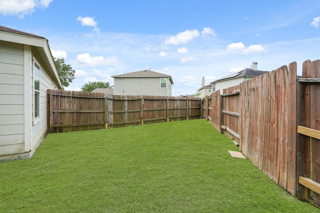 view of yard with a fenced backyard