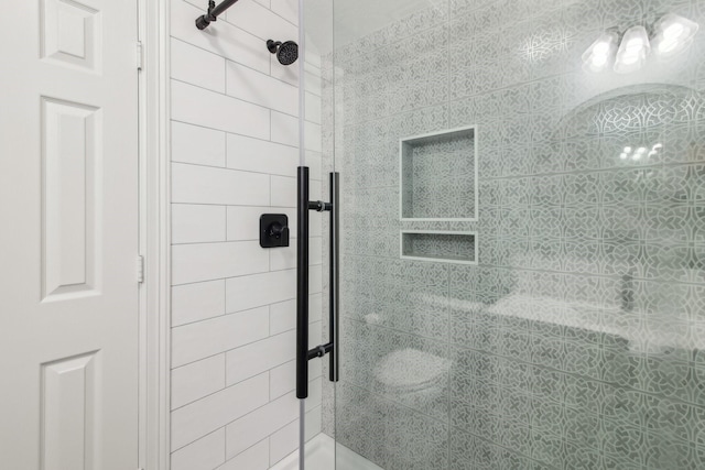 bathroom featuring a shower stall