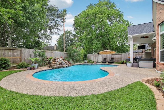 view of swimming pool with a fenced backyard, a fenced in pool, ceiling fan, and a patio area