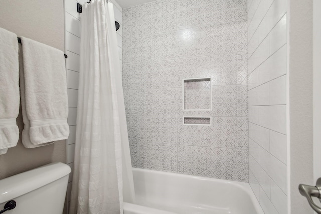 bathroom with toilet and shower / tub combo