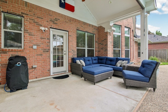 view of patio featuring an outdoor living space and a ceiling fan