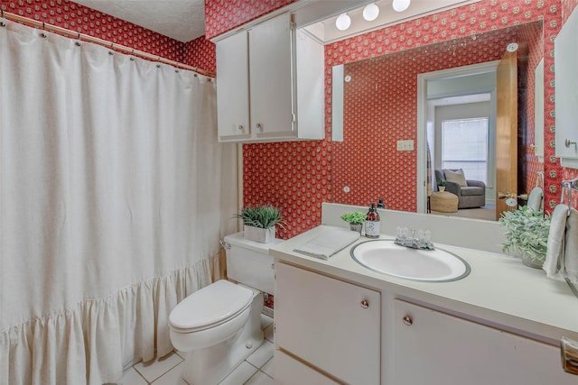 bathroom with vanity, tile patterned flooring, toilet, and wallpapered walls