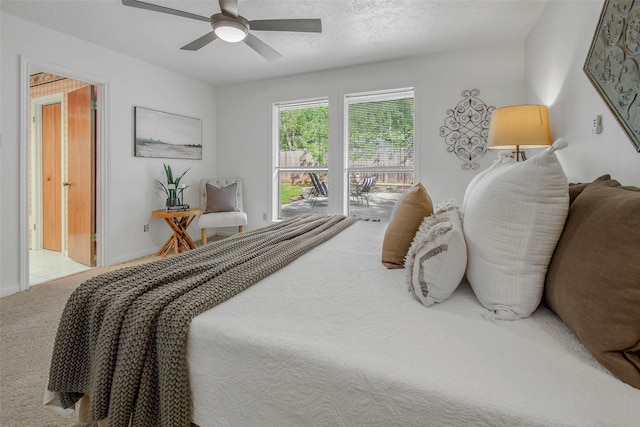 carpeted bedroom with baseboards and a ceiling fan