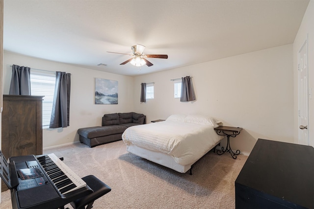 bedroom with visible vents, a ceiling fan, carpet, and baseboards