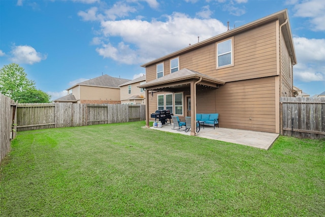 rear view of property featuring an outdoor living space, a fenced backyard, a lawn, and a patio