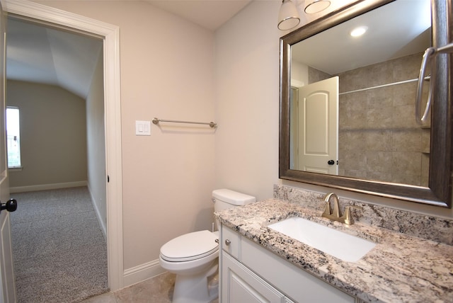 19019 Kimber Creek Ln, Cypress, TX 77429 - bathroom featuring toilet, vanity, baseboards, and lofted ceiling