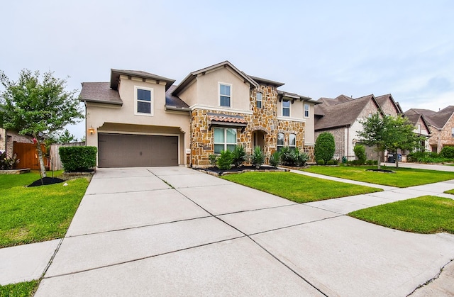 19019 Kimber Creek Ln, Cypress, TX 77429 - traditional-style home featuring stone siding, stucco siding, driveway, and a garage