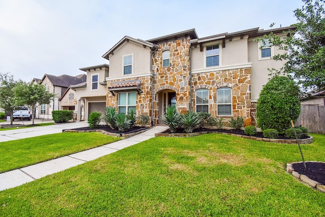 19019 Kimber Creek Ln, Cypress, TX 77429 - view of front of property featuring stone siding, stucco siding, a garage, and driveway