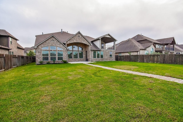 19019 Kimber Creek Ln, Cypress, TX 77429 - rear view of house featuring brick siding and a shingled roof
