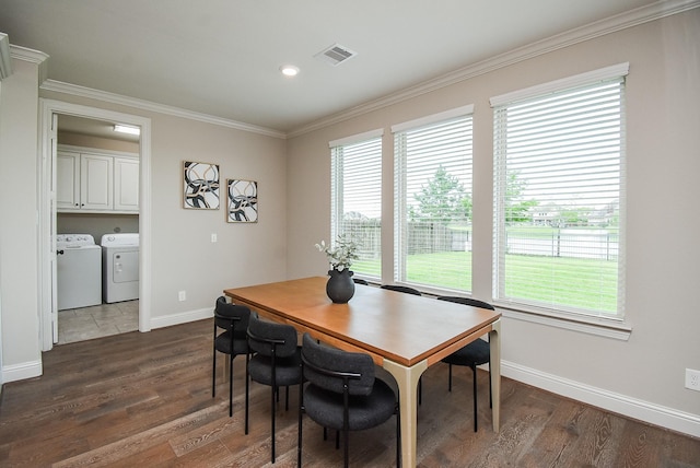 19019 Kimber Creek Ln, Cypress, TX 77429 - dining space with washing machine and dryer, ornamental molding, dark wood-style flooring, baseboards, and recessed lighting