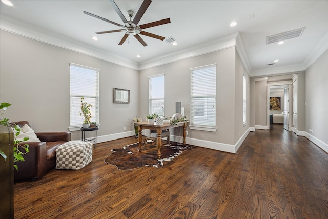 office space featuring ornamental molding, a ceiling fan, wood finished floors, and visible vents