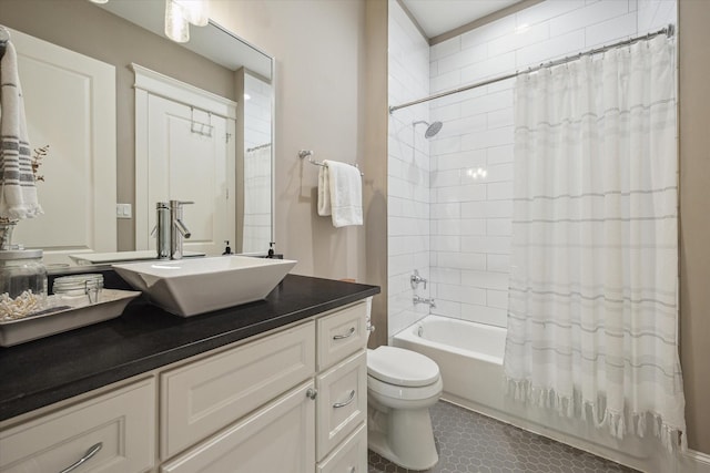 bathroom with vanity, shower / bath combination with curtain, and toilet