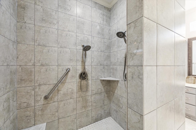 bathroom with crown molding and tiled shower
