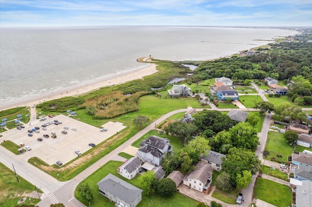 aerial view featuring a water view, a residential view, and a view of the beach