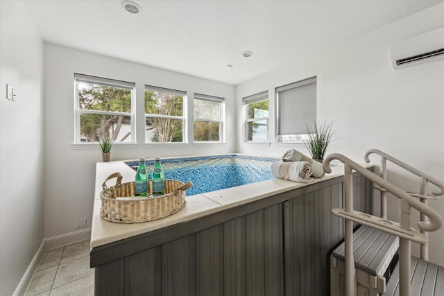 view of pool featuring a wall unit AC