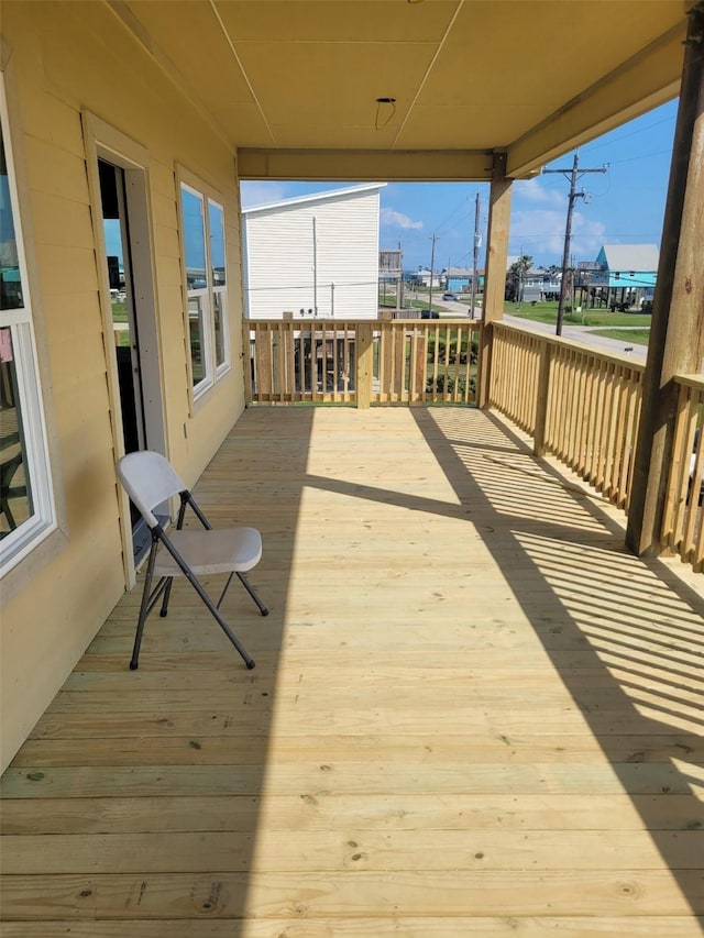 528 Thunder Rd, Surfside Beach, TX 77541 - wooden terrace with a carport