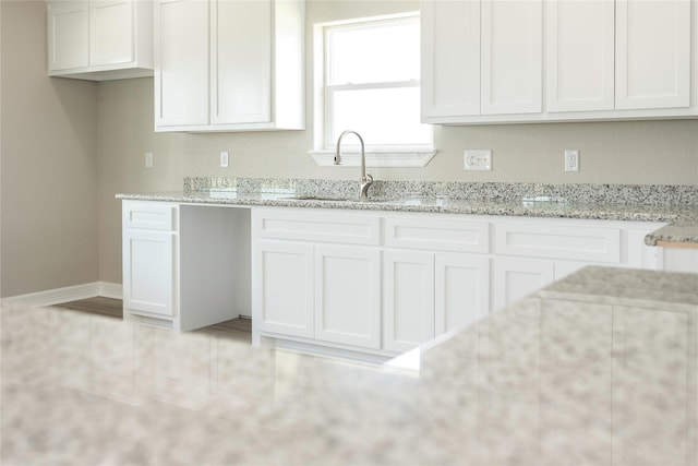 528 Thunder Rd, Surfside Beach, TX 77541 - kitchen featuring light stone counters and white cabinets