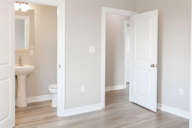 528 Thunder Rd, Surfside Beach, TX 77541 - half bathroom with toilet and wood finished floors