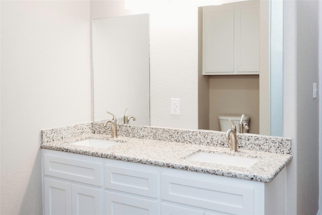 528 Thunder Rd, Surfside Beach, TX 77541 - bathroom with double vanity and toilet