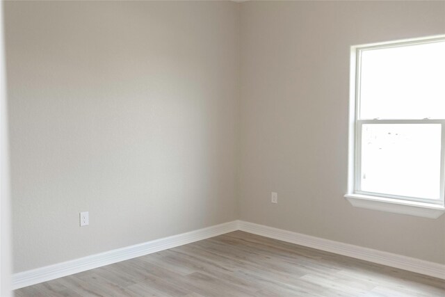 528 Thunder Rd, Surfside Beach, TX 77541 - empty room with light wood-style floors and baseboards