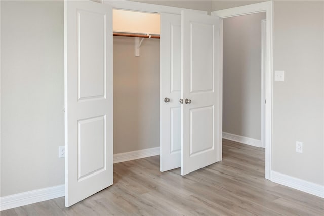 528 Thunder Rd, Surfside Beach, TX 77541 - unfurnished bedroom featuring light wood finished floors and a closet