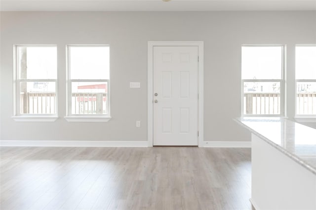 528 Thunder Rd, Surfside Beach, TX 77541 - foyer entrance featuring light wood-style flooring and baseboards