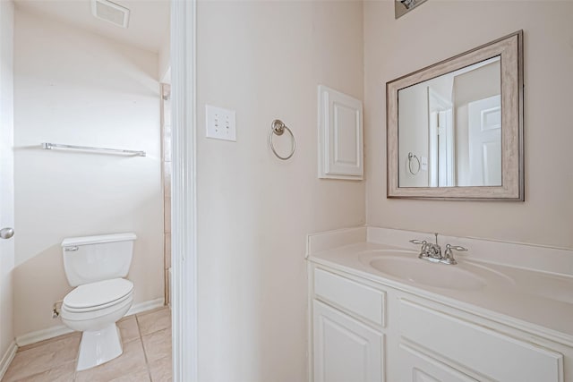 17931 Oakfield Glen Ln, Cypress, TX 77433 - bathroom with tile patterned flooring, vanity, toilet, baseboards, and visible vents