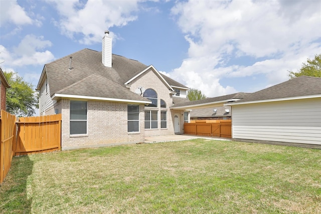 17931 Oakfield Glen Ln, Cypress, TX 77433 - back of property featuring a patio, a fenced backyard, a chimney, brick siding, and a yard