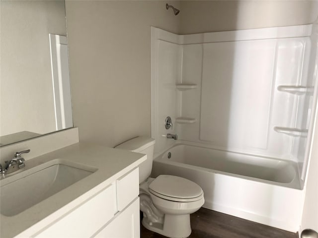 1563 Belton Ln, Anahuac, TX 77514 - bathroom with vanity, shower / bathtub combination, toilet, and wood finished floors