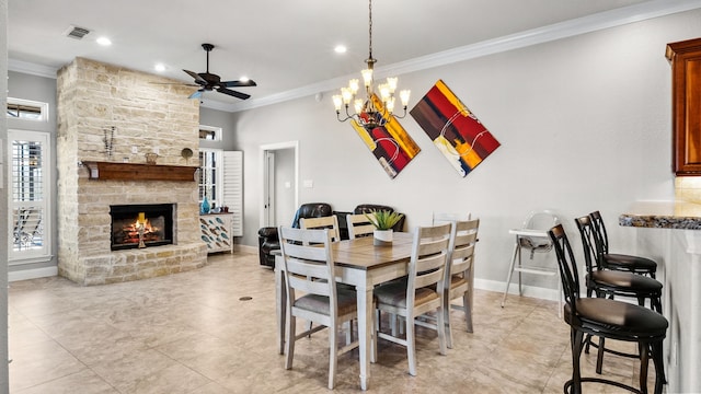 12722 Longmire Way, Conroe, TX 77304 - dining area with crown molding, a ceiling fan, a fireplace, recessed lighting, and light tile patterned floors