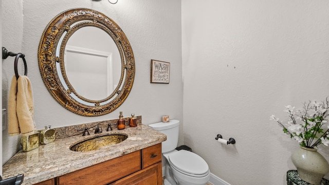 12722 Longmire Way, Conroe, TX 77304 - bathroom with toilet, vanity, and baseboards