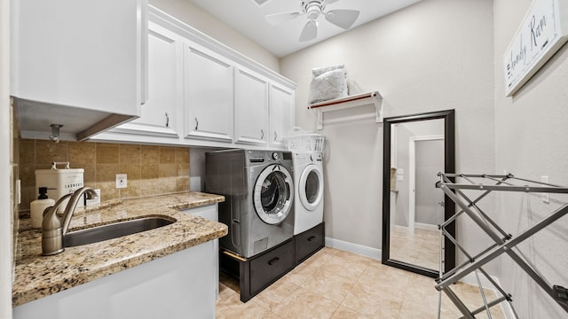 12722 Longmire Way, Conroe, TX 77304 - laundry area with washer and dryer, cabinet space, a ceiling fan, and light tile patterned flooring