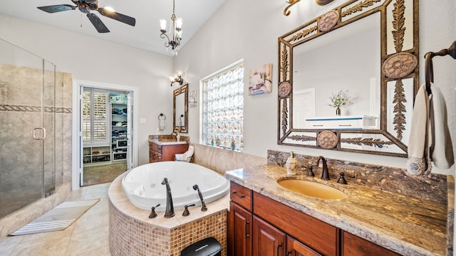 12722 Longmire Way, Conroe, TX 77304 - full bathroom with a stall shower, two vanities, a tub with jets, ceiling fan, and tile patterned flooring