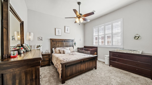 12722 Longmire Way, Conroe, TX 77304 - bedroom with light colored carpet, baseboards, and a ceiling fan