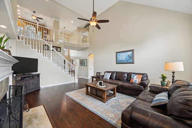 living area featuring wood-type flooring, stairway, recessed lighting, arched walkways, and a ceiling fan
