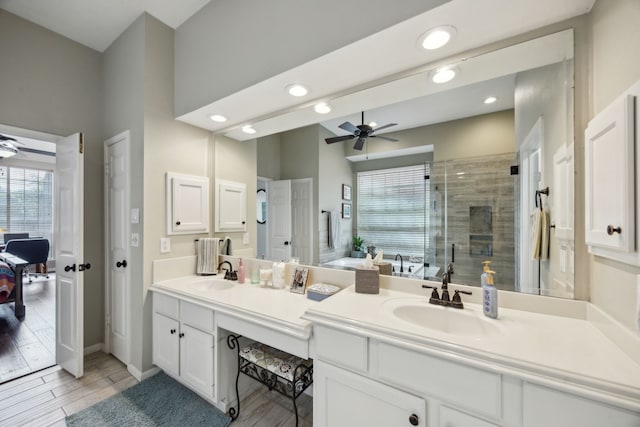 bathroom featuring a sink, ceiling fan, and a healthy amount of sunlight