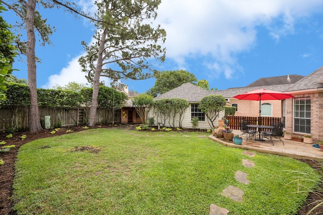 view of yard with a fenced backyard and a patio area
